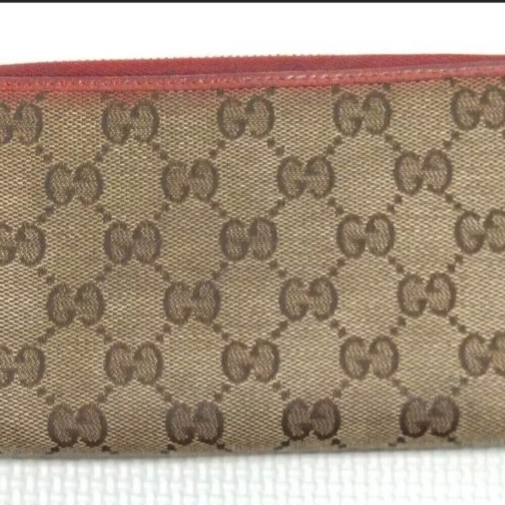 Gucci Zip Around Monogram Wallet